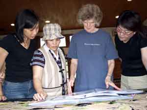Jane and others looking at the plant books