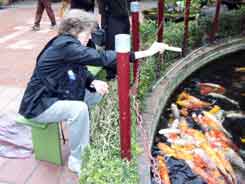 Jane feeding the fish