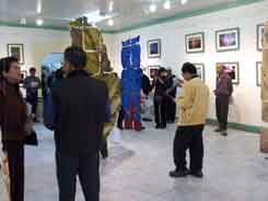 visitors viewing the works in the gallery