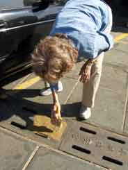 putting paper on drain cover at temple