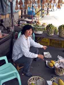 Lady selling mangos