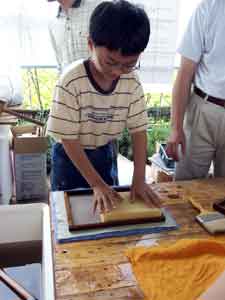 Boy making paper