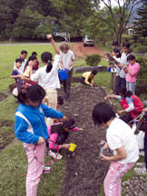 Children Pouring Seed on Gound for Living Yilan Map