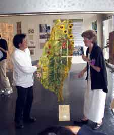 Jane presenting Dr Wu with a site map